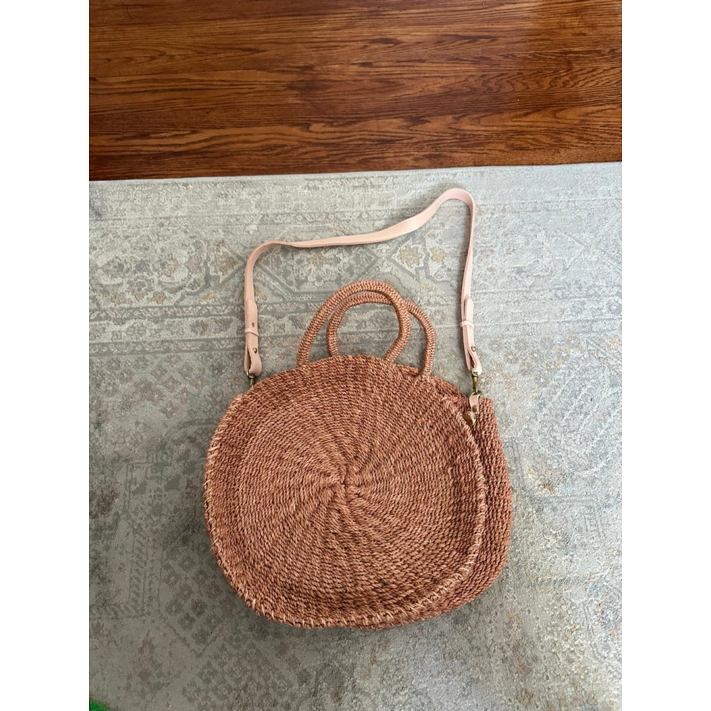 Clare V Woven Round Crossbody Bag in Natural Tan.
